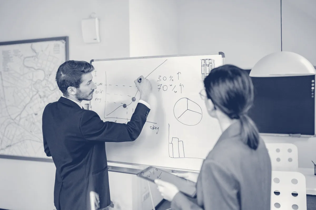 Analysts working through a problem together.